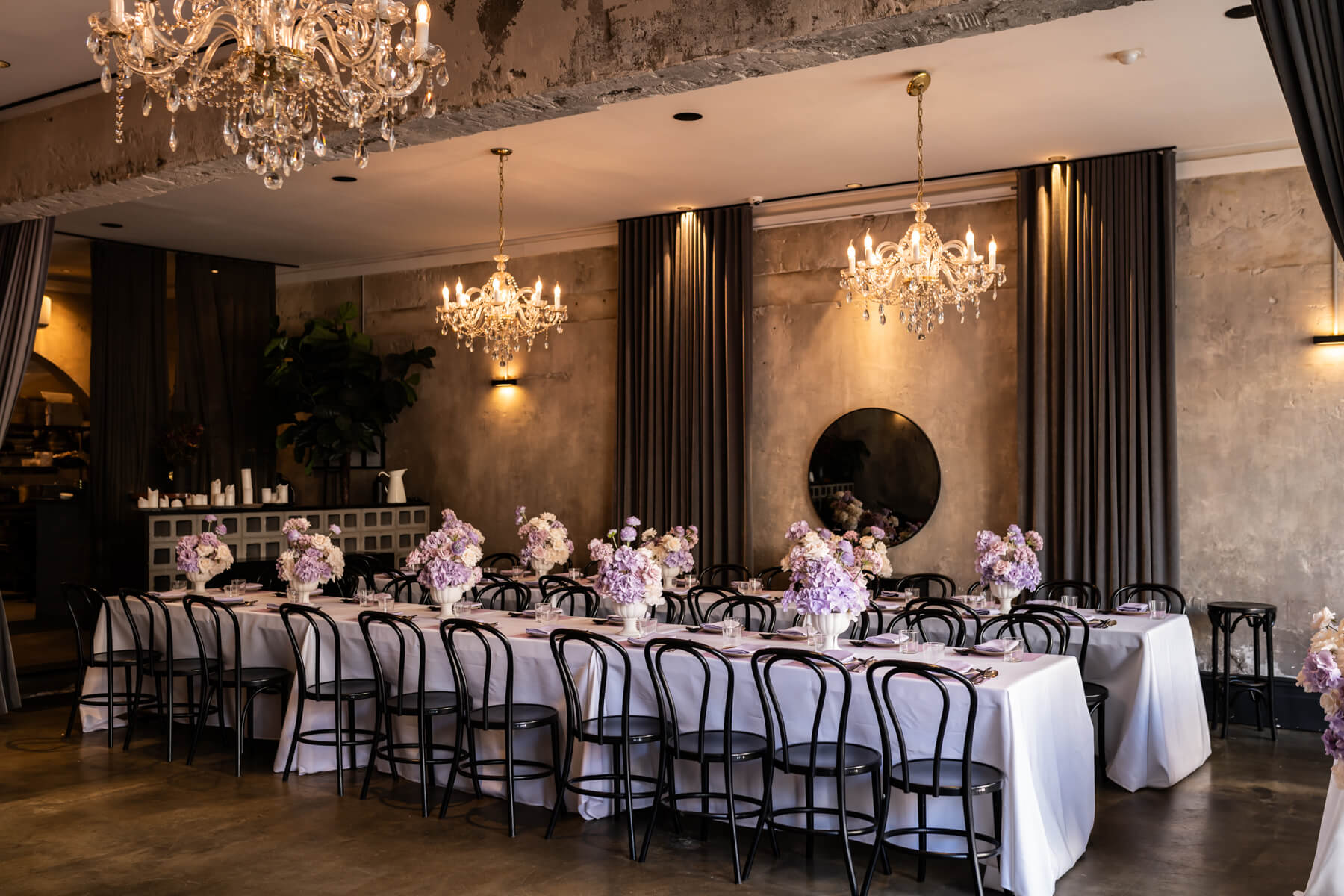 Styled Venue Aunty Kims, in Melbourne Australia. Venue is Styled by Steph from Carter & Ko, Melbourne's leading wedding and event stylist. The venue is styled in crisp white table clothes and flowers in lavendar hues. Corporate event photographer in Melbourne, Melbourne Photography, Australia.