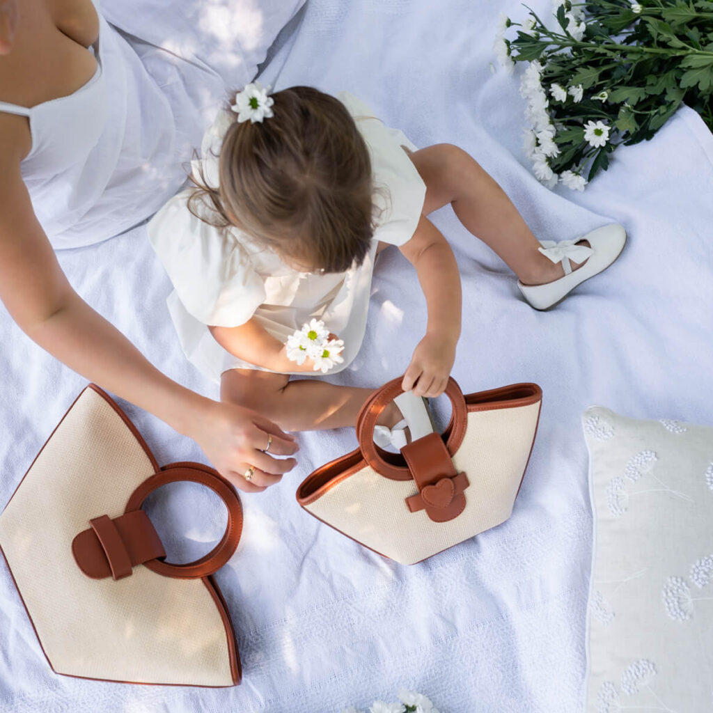 Melbourne Product photographer, Picnic, garden setting, image of mother and daugther and their matching handbags, Melbourne Product Photography
